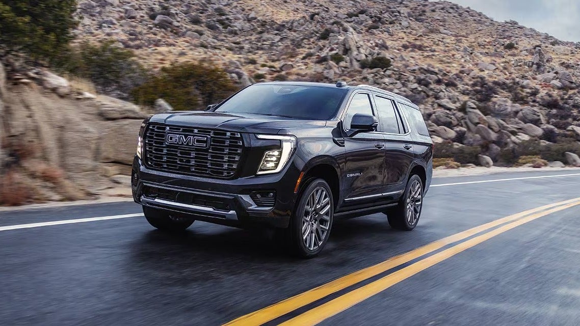 GMC Yukon full-size SUV driving on an open road